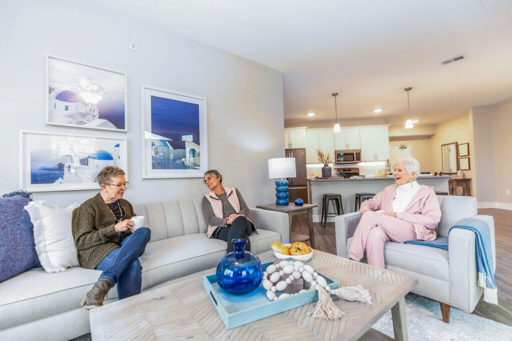 Homeowners in the living room at a 55+ active adult community